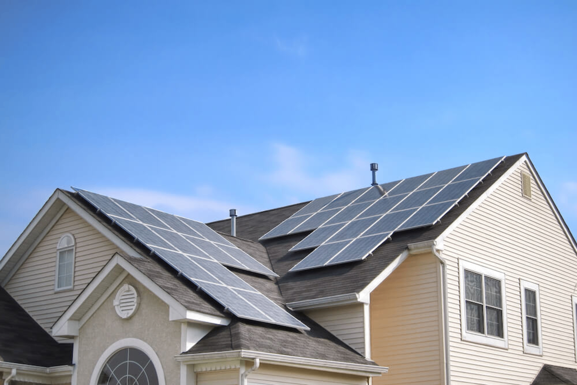 Aerial view of solar panels installed on a residential roof